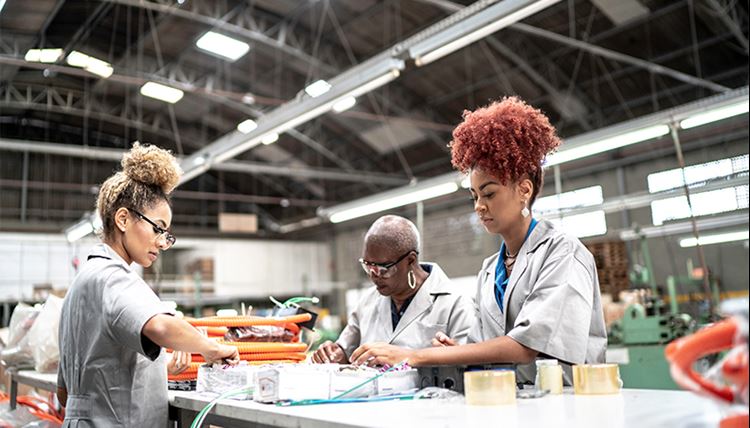 Sustainable market development Factory workers in grey robes handling products and material